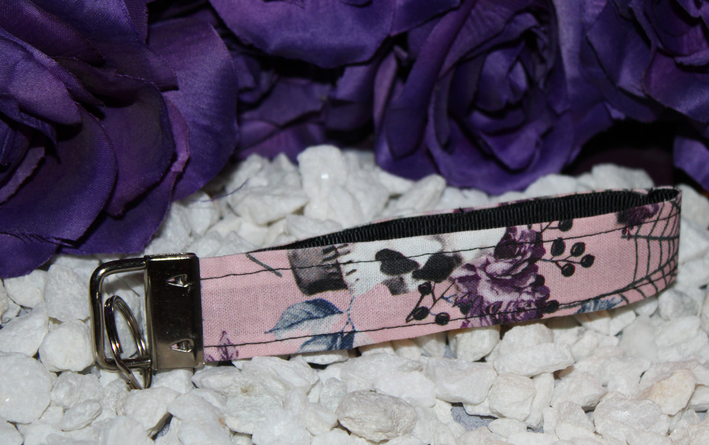 Feminine Skull and Flowers Wristlet Keychain with Pink Background