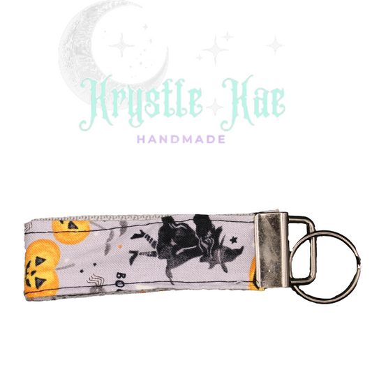 Enchanting Witch and Bats Key Fob Wristlet with Playful Pumpkins