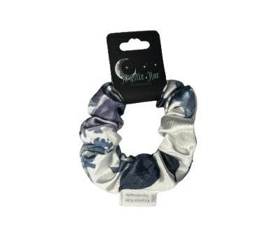 Blue and white patterned scrunchie on a white background