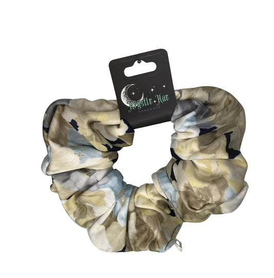 Scrunchie with camouflage pattern on a white background